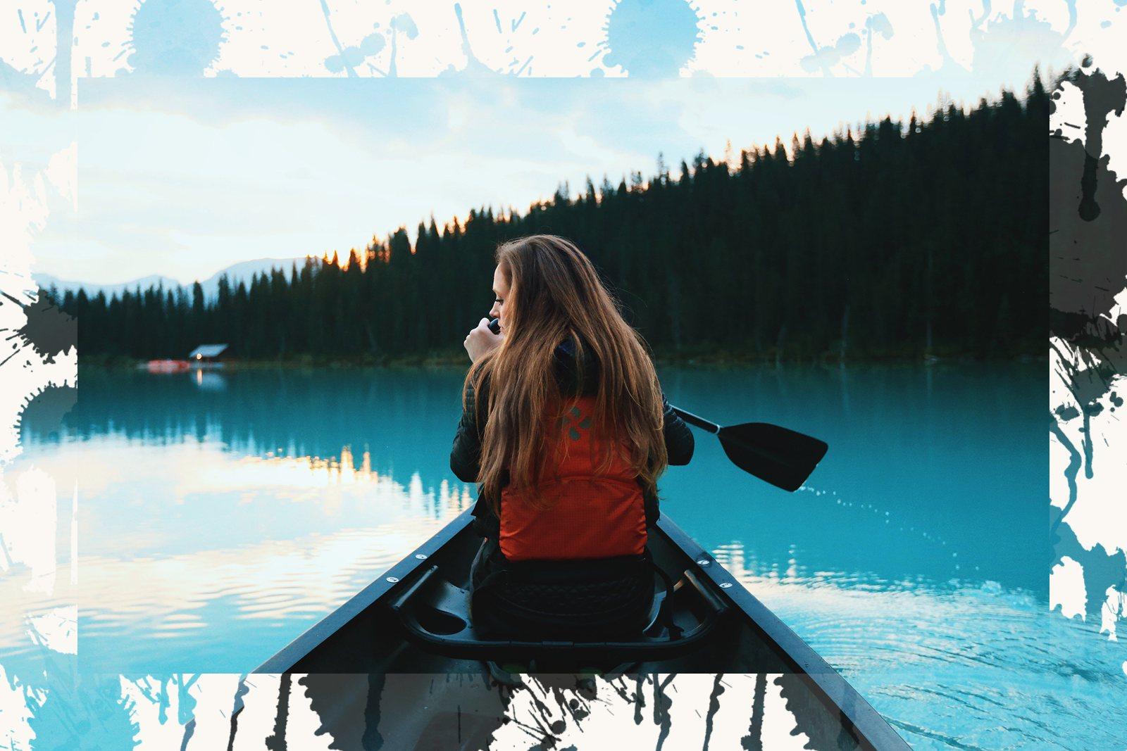 A lake photo whose edges dissolve into splattered ink instead of ending in a straight line