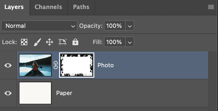 Photoshop's Layers panel showing the photo layer's mask: a white rectangle with splatter marks breaking up its edges