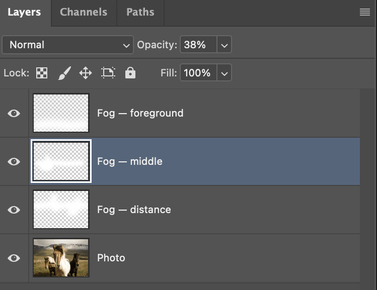 Photoshop's Layers panel with three fog layers stacked at different opacities above the photo